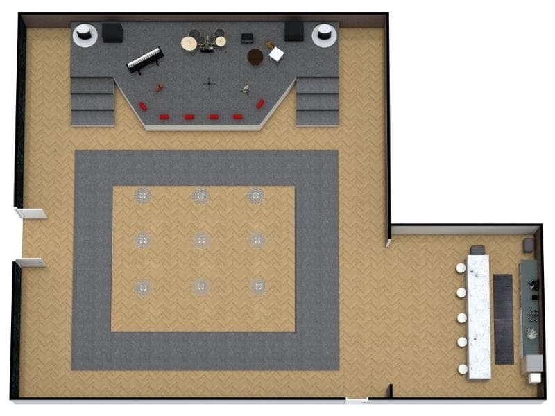 3D floor plan of a concert hall with a raised stage featuring a drum set, keyboard, and microphones. The main floor includes an open dance or standing area surrounded by gray carpeting, while a bar with stools and a counter is located in a side room.