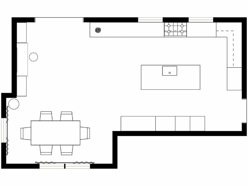 Black and white floor plan of an open-concept kitchen and dining area. The space features a large L-shaped kitchen counter along the top and right walls, a central island with a sink, and a dining table with six chairs in the lower left. There's a sofa along the bottom wall and a small seating area with a circular side table in the upper left. Two large windows or sliding doors are shown on the left and bottom walls, indicating access to the outdoors or natural light. Furniture and fixtures are represented with simple line drawings.