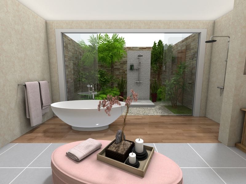 3D-rendered modern bathroom designed with interior design software. The space features a freestanding bathtub in front of a full glass wall that opens to a lush, enclosed outdoor shower garden. The room includes a wall-mounted shower, soft beige walls, a mix of tile and wood flooring, and a pink ottoman with a decorative tray holding candles, towels, and a small plant.