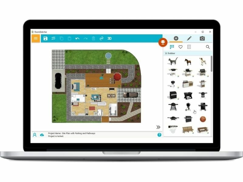Site plan software interface on a laptop screen, displaying a detailed outdoor property layout with landscaping elements, buildings, and outdoor furniture.